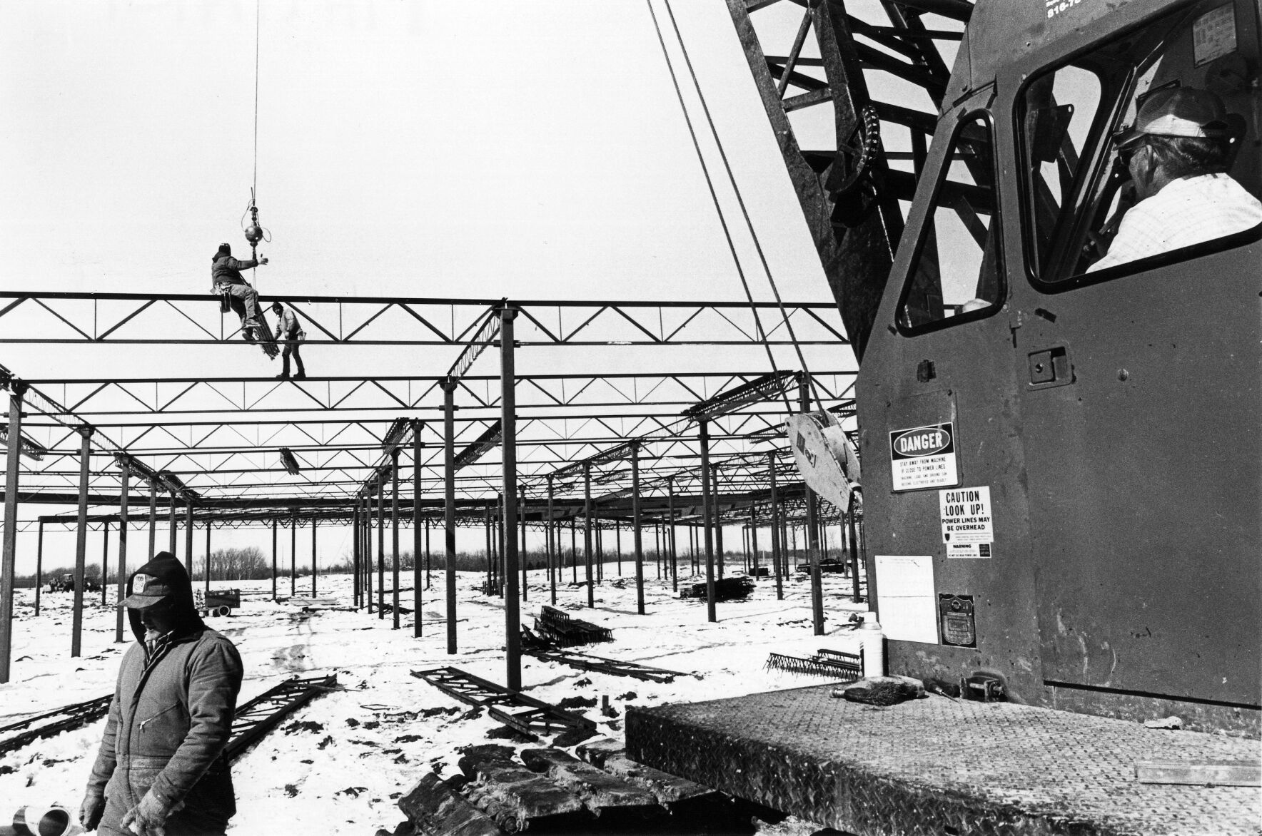Workers put up steel frames